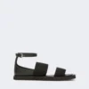 Flache Sandalen aus Leder und elastischem Gurtband, schwarz Flache Sandalen aus Leder und elastischem Gurtband, schwarz